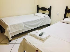 Postel nebo postele na pokoji v ubytování Hotel Oliveira