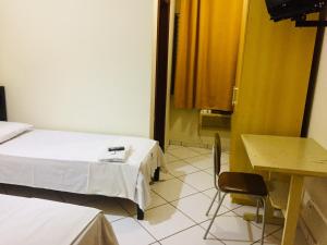 Postel nebo postele na pokoji v ubytování Hotel Oliveira