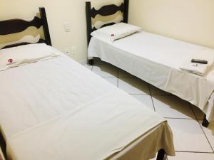 Postel nebo postele na pokoji v ubytování Hotel Oliveira
