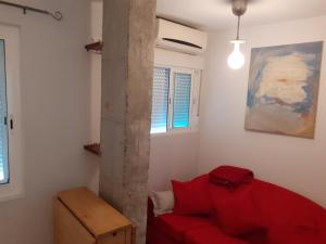 Łóżko lub łóżka w pokoju w obiekcie Apartamentos Málaga Centro Hernán Ruiz de 4 a 8 Personas