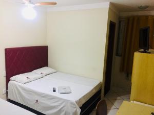 Postel nebo postele na pokoji v ubytování Hotel Oliveira