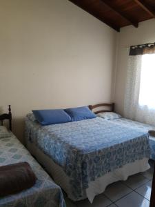 Ein Bett oder Betten in einem Zimmer der Unterkunft Casa da Vivi