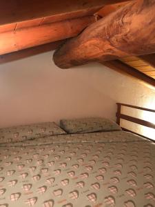 Postel nebo postele na pokoji v ubytování Agriturismo Luloc
