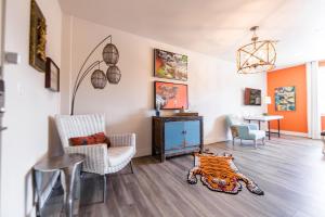 a living room with a tiger rug on the floor at The Bishop Arts Hotel By Bluelofts in Dallas