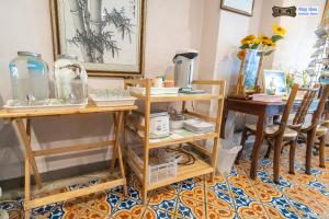 a room with two tables and two chairs at Ming Shou Boutique House in Phuket