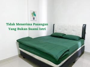 Letto o letti in una camera di Anugrah Inn