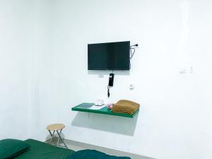 TV o dispositivi per l'intrattenimento presso Anugrah Inn