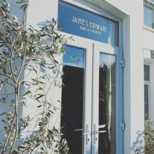 a sign on the door of a building at The White House Hotel in Newquay