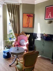 a living room with a couch and a table at The White House Hotel in Newquay