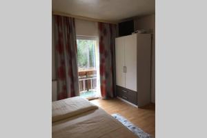 Posteľ alebo postele v izbe v ubytovaní Gemütliches Ferienhaus am Waldrand