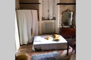 Un ou plusieurs lits dans un hébergement de l'établissement Palazzo Costantini Ludovica Home