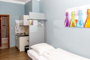 Postel nebo postele na pokoji v ubytování Apart Hotel Sarstedter Hof