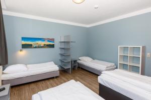 Postel nebo postele na pokoji v ubytování Apart Hotel Sarstedter Hof