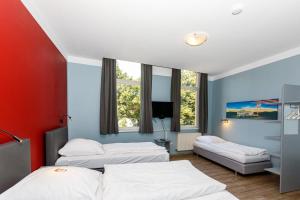 Postel nebo postele na pokoji v ubytování Apart Hotel Sarstedter Hof