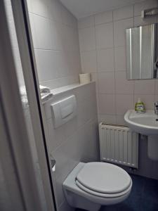 Koupelna v ubytování Apart Hotel Sarstedter Hof