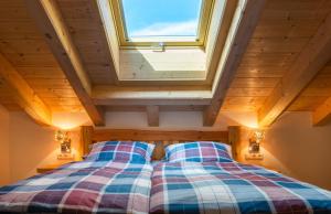Postel nebo postele na pokoji v ubytování Alpenchalet St.Ulrich