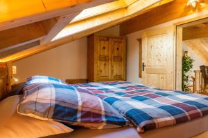 Postel nebo postele na pokoji v ubytování Alpenchalet St.Ulrich