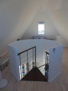 a room with a white table with shelves at Speicher Residenz Barth E7 App 1 in Barth