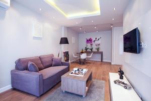 a living room with a couch and a table at Oxygen Residence in Warsaw