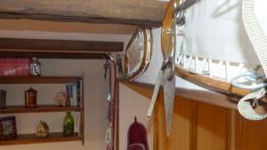 a kitchen with a shelf and a pair of scissors at COMO EN TU CASA Canfranc Estación in Canfranc-Estación