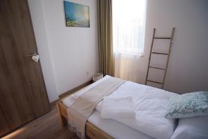 Posteľ alebo postele v izbe v ubytovaní Art Gallery Apartment