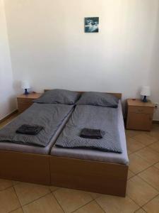 Posteľ alebo postele v izbe v ubytovaní Penzion Adamčík