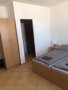 Posteľ alebo postele v izbe v ubytovaní Penzion Adamčík