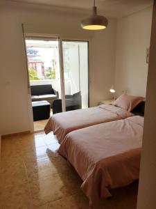 Posteľ alebo postele v izbe v ubytovaní Appartement Torre La Mata + 20 fotografií