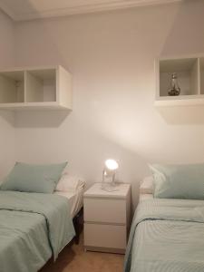 Posteľ alebo postele v izbe v ubytovaní Appartement Torre La Mata