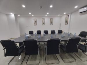 a conference room with a long table and chairs at Season Inn Hotel in Barka