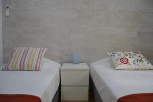 Ein Bett oder Betten in einem Zimmer der Unterkunft Cerca da Vitoria 2 Sesimbra