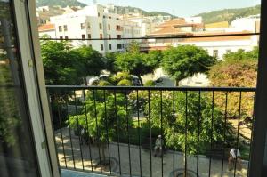 a view of a city from a balcony at Cerca da Vitoria 2 Sesimbra in Sesimbra