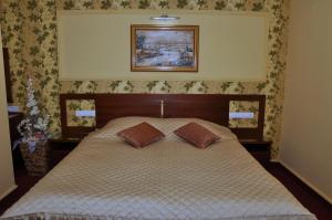 Säng eller sängar i ett rum på Hotel Botika
