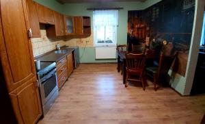 Kuchyň nebo kuchyňský kout v ubytování Venkovské apartmány Tiché pastviny