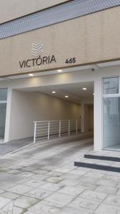 a sign on the side of a building at Apartamento em Torres in Torres