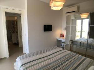 Posteľ alebo postele v izbe v ubytovaní Vista Mare Apartment con parcheggio privato