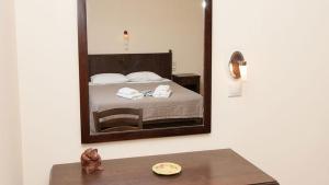 Postel nebo postele na pokoji v ubytování Anopoli Rooms