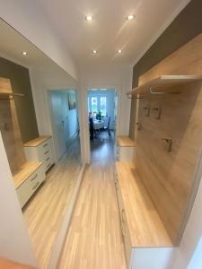 a large kitchen with wooden floors and a dining room at Einfamillienhaus in Rustenfeld