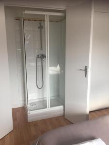 a shower with a glass door in a bathroom at Aux portes de Pornichet, Chambres d'hôtes Ty'Sacha in Saint-Nazaire +131 photos