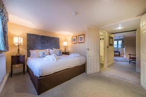 
A bed or beds in a room at The Talbot Hotel, Oundle , Near Peterborough
