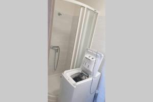 a bathroom with a toilet and a shower at Útulný apartman Kmeťova in Košice