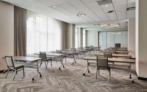 a row of tables and chairs in a room at Hyatt House Chicago Medical/University District in Chicago