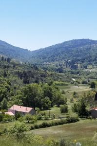 a view of a valley with mountains in the distance at Turismo Rural Macieira Brava in Guarda