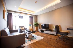TV a/nebo společenská místnost v ubytování Yashi International Aparthotel