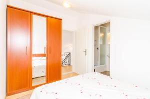 Posteľ alebo postele v izbe v ubytovaní Cozy duplex apartment A1, close to the Sunset Beach near Dubrovnik