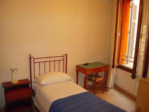 En eller flere senge i et værelse på Riva Reno GuestHouse