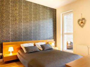 Postel nebo postele na pokoji v ubytování VacationClub – Bałtycka 10 Apartament 15