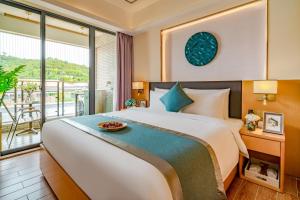 Кровать или кровати в номере Dingshang Apartment Hotel