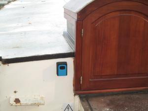 a wooden cabinet sitting on top of a building at studio sur péniche La Tortue in Ramonville-Saint-Agne