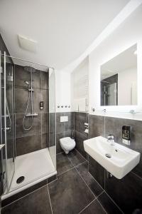 Ett badrum på Sonata City Hotel